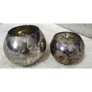 Small detailed decorative glass jars.